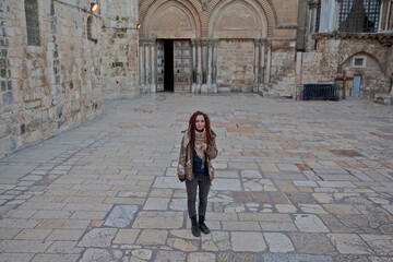 Young woman near Church of the Holy Sepulchre in Old City of Jerusalem
