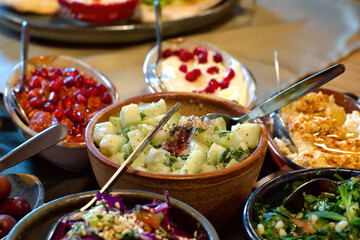 Aramic mezze platter (starters) - hummus, mutabbal, babaganosh, tabbouleh, pita