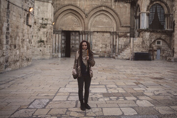 Young woman near Church of the Holy Sepulchre in Old City of Jerusalem