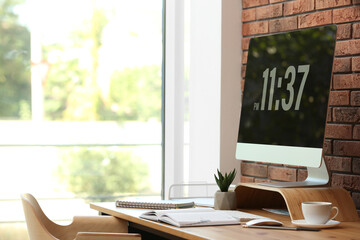 Modern computer and supplies on table in office. Space for text