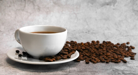 Side view of a cup of coffee surrounded with coffee beans against concrete background.