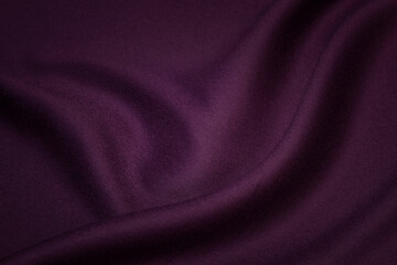 Dark purple background from woolen texture textile, closeup. Structure of the eggplant color ...
