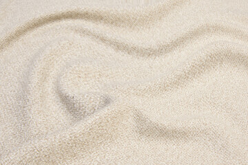 Fototapeta na wymiar Beige knitted woolen background. Knitwear fabric texture.