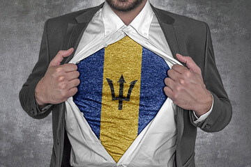 Business man show t-shirt flag of Barbados rips open his shirt