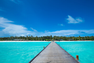 Obraz premium Beautiful beach with white sand. ocean, blue sky with clouds. Sunny day. Maldives tropical landscape