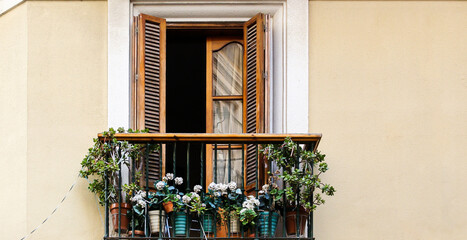 Fototapeta na wymiar Typical oldtown balcony flower pots in Andalusia, Spain