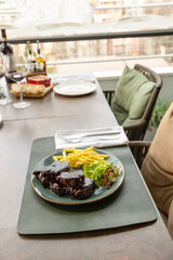 Sticky oven barbecue ribs served with french fries