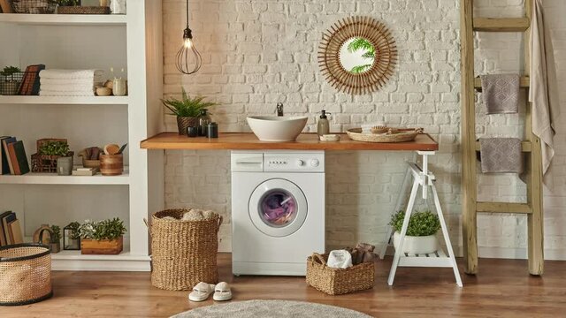 Modern laundry room, white washing machine in the wooden bench, decorative bookshelf, new style bath room.