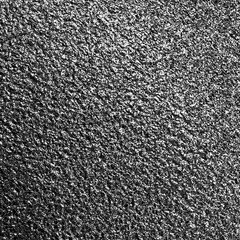 Black metallic foil paper texture background.
