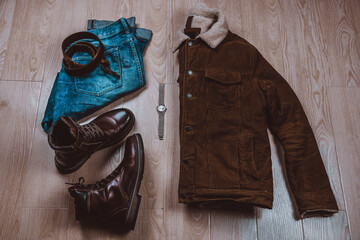 Men's casual outfit. Men's fashion clothing and accessories on a wooden floor