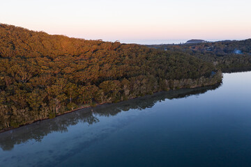 aerial sunset landscape with glassy lake