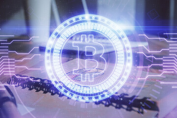 Double exposure of blockchain theme drawings and desk with open notebook background. Concept of Crypto currency