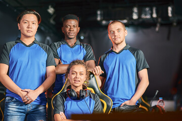 Champions. Group of multiracial cybersport gamers looking at camera, participating in eSport...