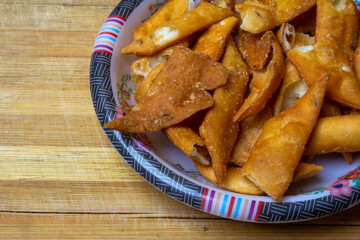 Corner shot of a plate with spicy crispy salty chips