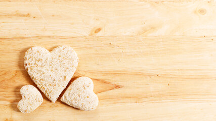 Obraz premium a heart shape cutted out of wholewheat bread