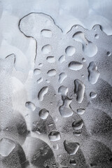 Close up view of water rain drops on a metal surface