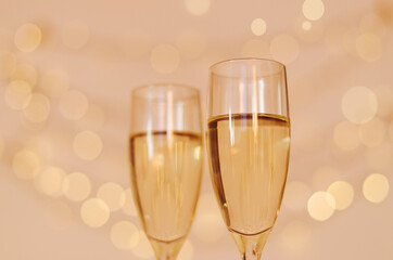Two glasses of wine with bokeh background close up. Top view. New Year, Christmas mood. Greeting card. Party and holiday celebration concept.