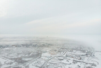 Fototapeta na wymiar City view in fog. Winter in Arkhangelsk 