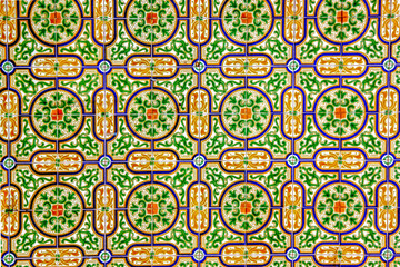 Traditional green, yellow, blue, orange and white Portuguese wall tiles
