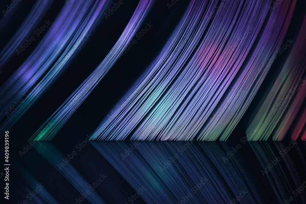 Fototapete Close up Beautiful book pages in the color light on a night. Background pattern for design. Macro photography view.