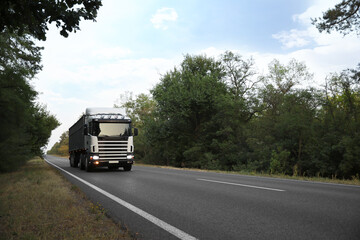 Beautiful view of asphalt highway with truck. Road trip