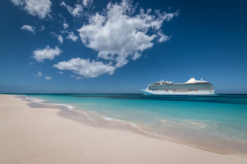 Summer cruise vacation and tourism concept. Side view of cruise ship at the beach.