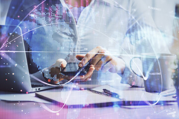 Double exposure of business theme sketch hologram and woman holding and using a mobile device.