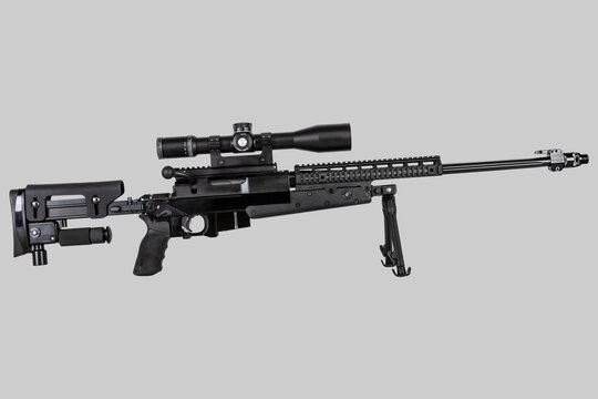 rifle in black on a light gray background. sniper weapon close-up, isolate.