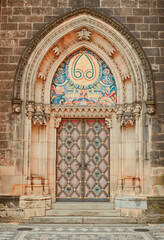 Obraz premium PRAGUE, CZECH REPUBLIC - July 24, 2013:Ornamented entrance doors to Basilica. Prague, Czech Republic.