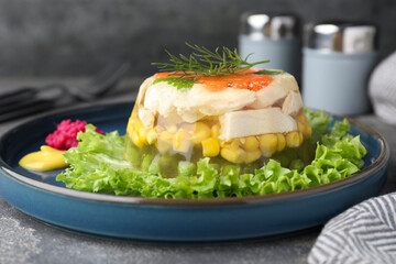 Delicious chicken aspic served on grey table, closeup