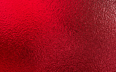 Red shiny foil metallic paper texture background. Use for christmas and valentine day concept.