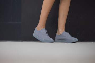 Woman wearing grey shoes outside © Stanislav