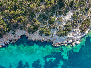 Aerial panoramic view of the picturesque old harbor Gerakas in northern Alonnisos, Greece. Beautiful scenery with rocky formation and natural fjord-like bay in Sporades Aegean sea, Greece