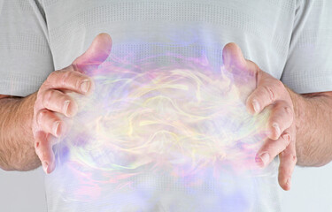 High Resonance White Light Healing Energy Phenomenon  - male healer with hands apart at chest level...