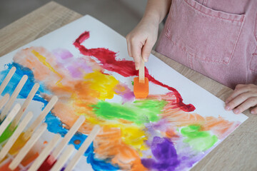Kid painting with ice paints. Creativity, Diy, homemade activities for toddlers.
