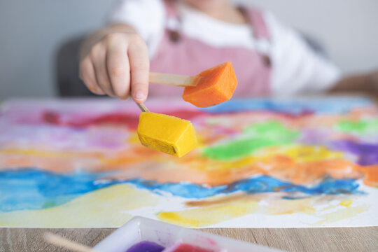 Kid painting with ice paints. Creativity, Diy, homemade activities for toddlers.