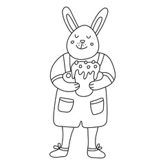 An funny smiling male rabbit or bunny  with an Easter cake. He is wearing pants with pockets and suspenders. Hand drawn vector illustration isolated on white background. Doodle style. Black outline.