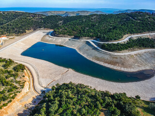 Panoramic view of the man-made lake in Alonnisos island, Greece. The project was created as a solution to the water shortage problem to the island of Alonnisos, Sporades, Greece