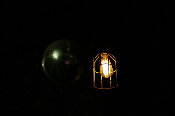 Single Vintage Lightbulb in dark background