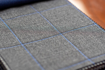 grey and blue squared plaid fabric. Expensive men's suit fabric material for wedding suitor Patterned jacket for men. High resolution