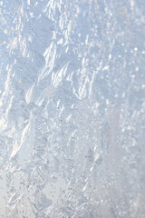 Beautiful frosty window as background, closeup. Winter morning