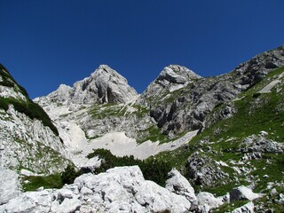 Rocky mountains landscape and mountain peaks of Vrsaki and Miseljski konec in Julian alps and...