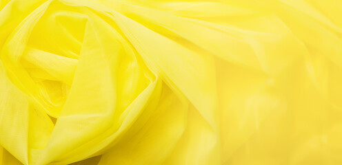 abstract fabric texture. Colors of the year 2021 - yellow. Color trend palette. Top view, flat lay. tulle fabric