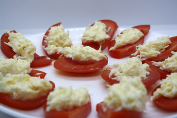 Tomatoes stuffed with cheese with garlic and mayonnaise.