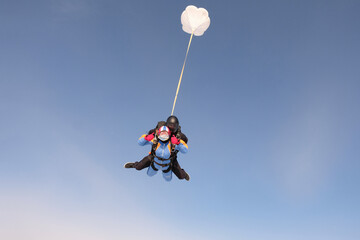 Obraz na płótnie Canvas Skydiving. Tandem jump. Active adventure.