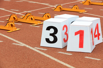 Track numbers and starters on the plastic track on the playground