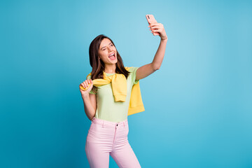 Portrait of pretty funky cheerful flirty girl taking making selfie winking having fun isolated over...