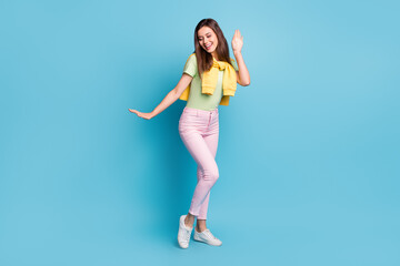 Fototapeta na wymiar Full length body size view of charming cheerful girl dancing having fun free time pastime isolated over bright blue color background