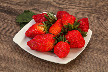 Ripe sweet strawberry with leaf