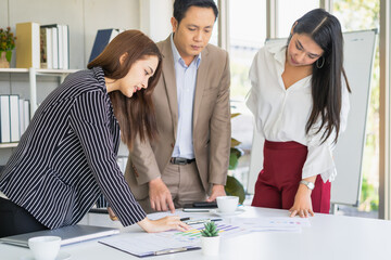 Hand of team, group young businessman,businesswoman people working marketing plan,discussing on paperwork with teamwork,colleagues at office,workplace.Brainstorm business concept.